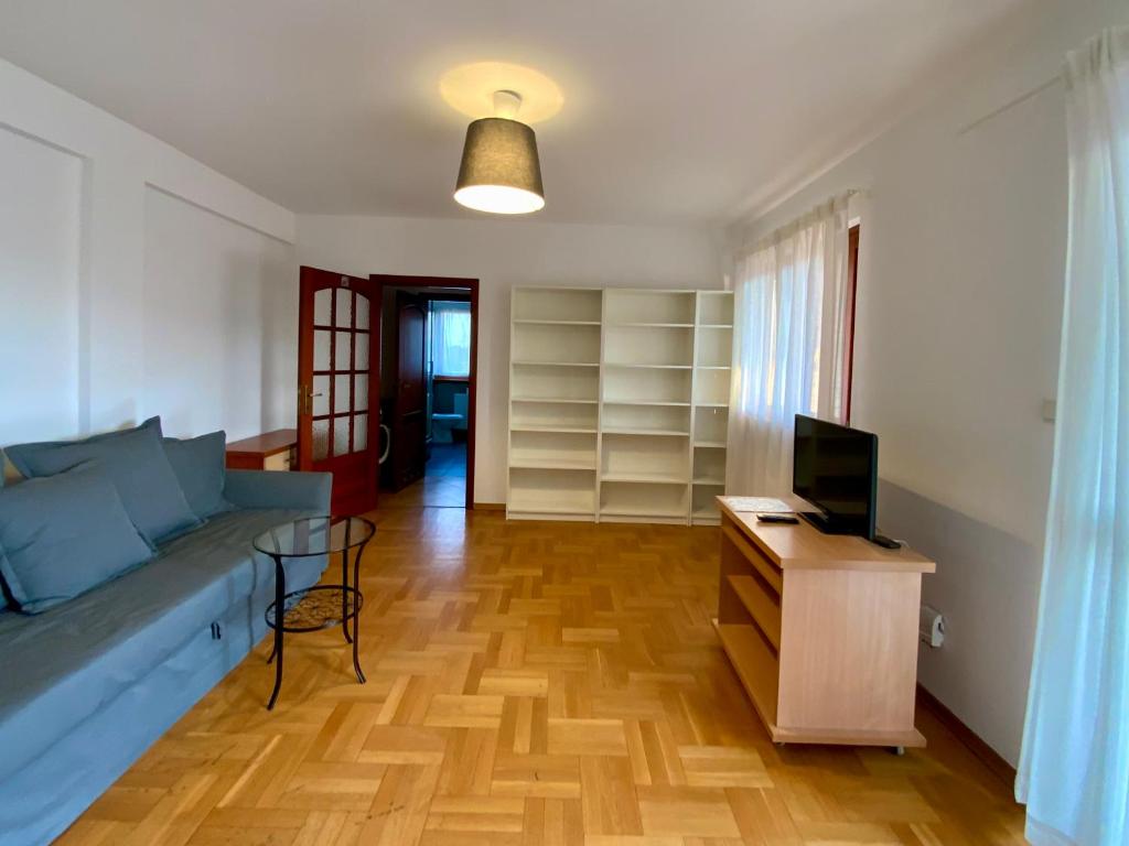 Televízia a/alebo spoločenská miestnosť v ubytovaní Villa Verona