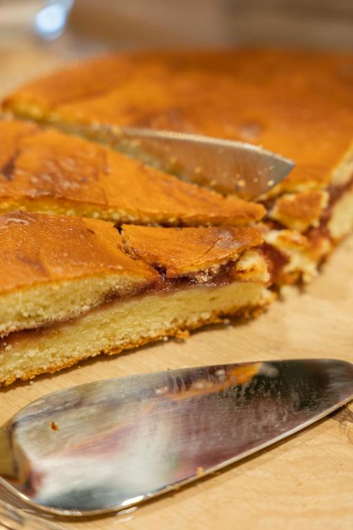 a knife sitting next to two slices of cake at Casa Vettor in Valdobbiadene
