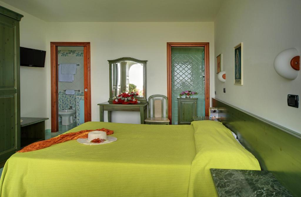 Postel nebo postele na pokoji v ubytování Hotel Casa del Sole