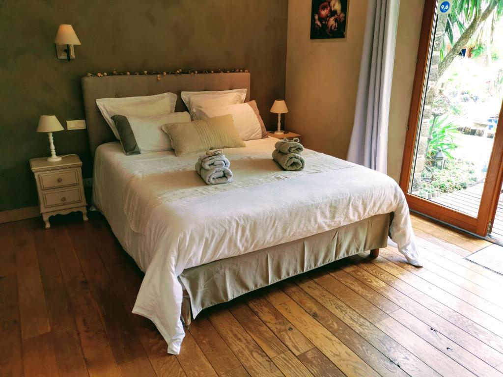 Postel nebo postele na pokoji v ubytování B&B Lou Mas