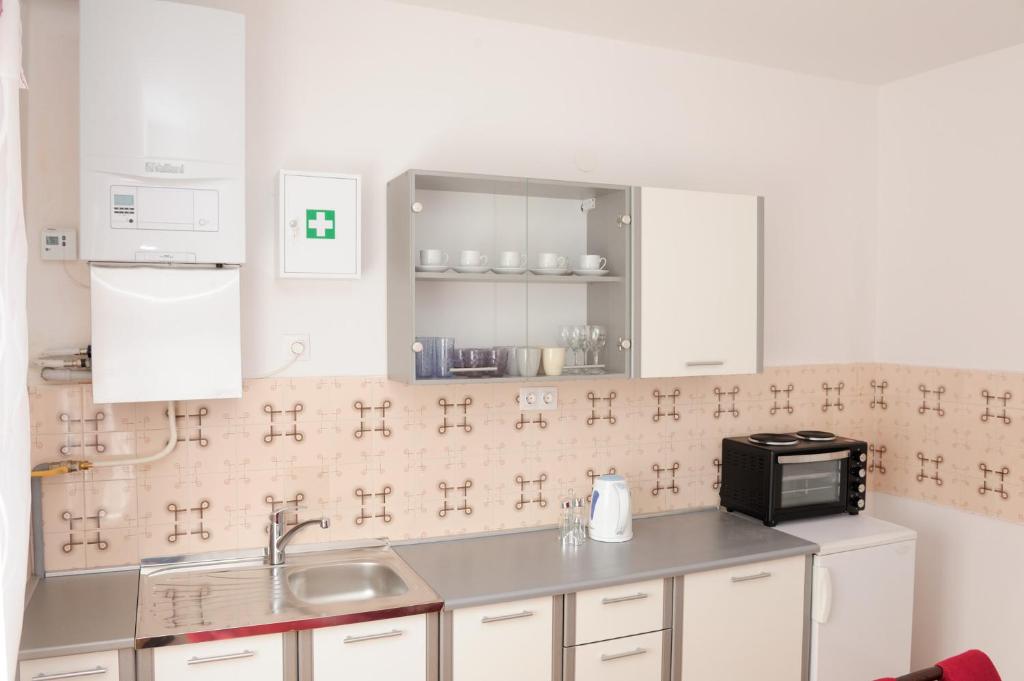 Kuchyňa alebo kuchynka v ubytovaní Apartman Noa 16