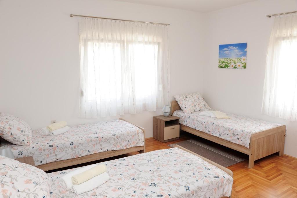 Posteľ alebo postele v izbe v ubytovaní Apartman Noa 16