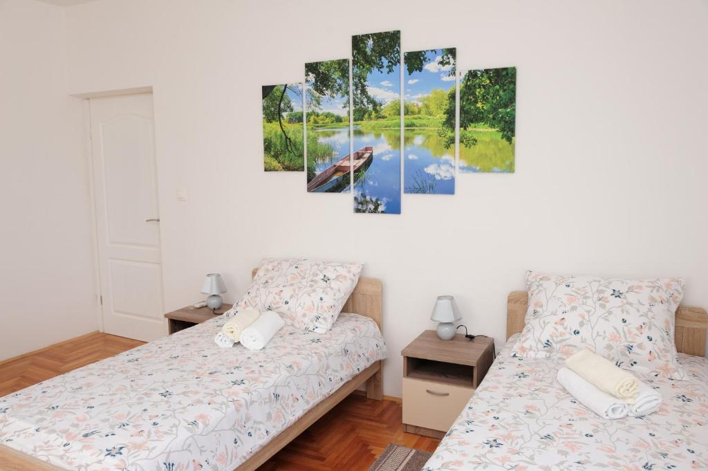 Posteľ alebo postele v izbe v ubytovaní Apartman Noa 16
