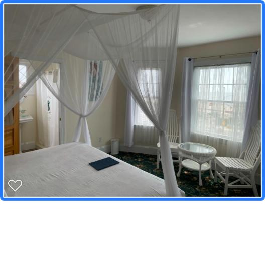Postel nebo postele na pokoji v ubytování Hotel Macomber
