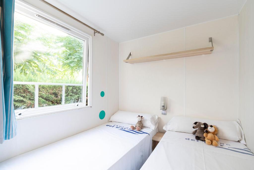 Postel nebo postele na pokoji v ubytování Camping Del Mar