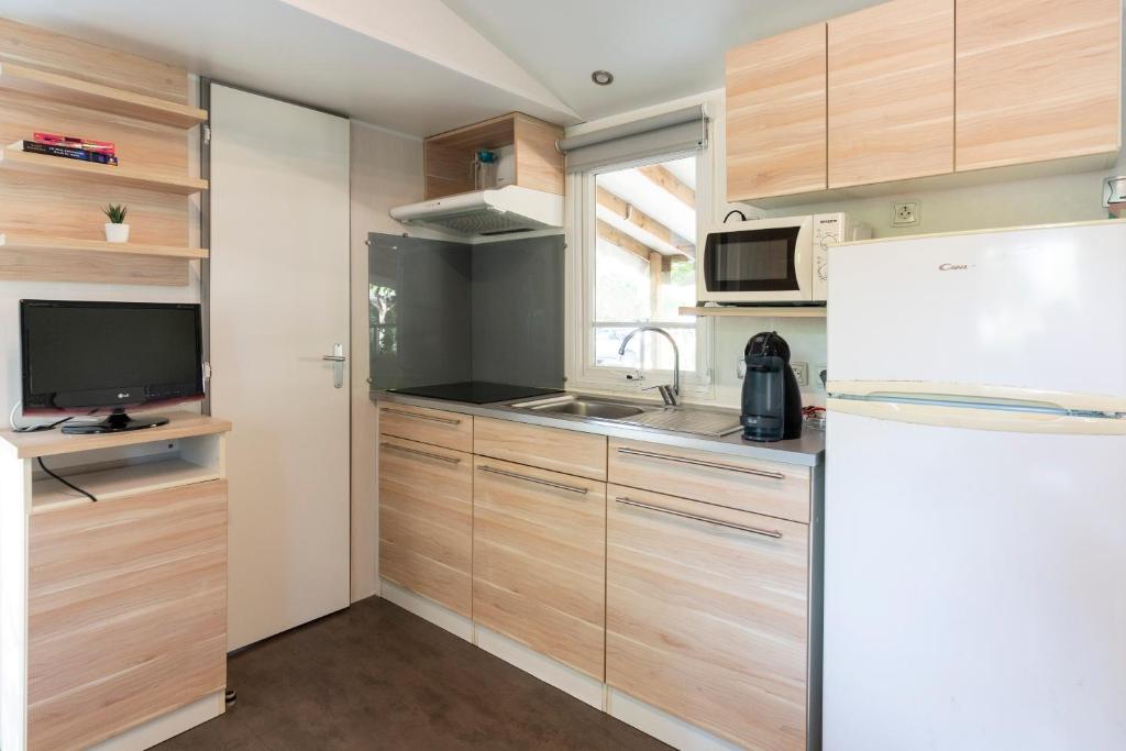 Kuchyň nebo kuchyňský kout v ubytování Camping Del Mar