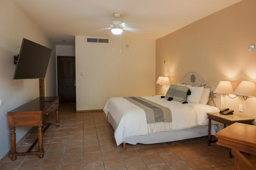 Postel nebo postele na pokoji v ubytování Reef Yucatán All Inclusive & Convention Center