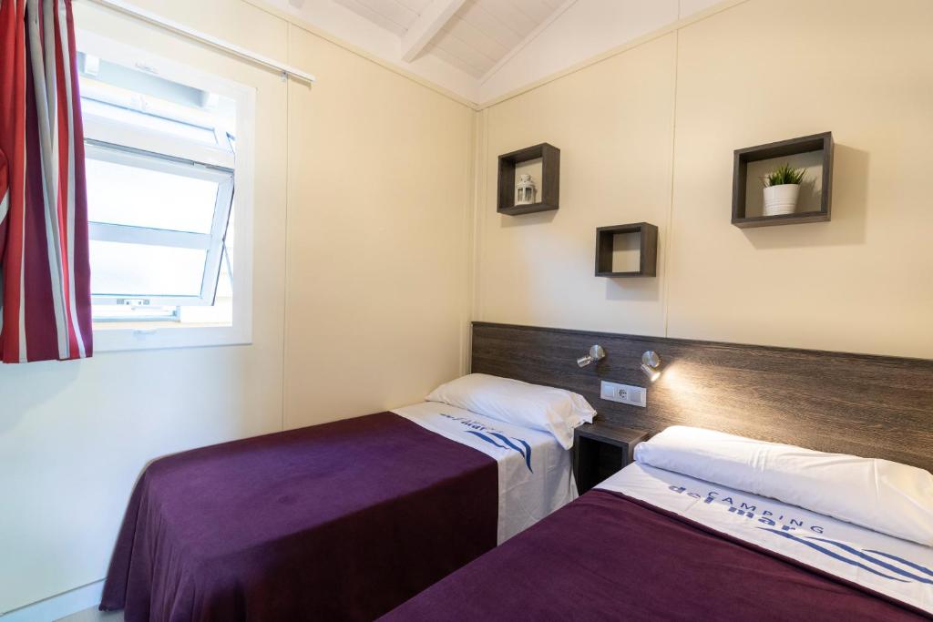 Postel nebo postele na pokoji v ubytování Camping Del Mar