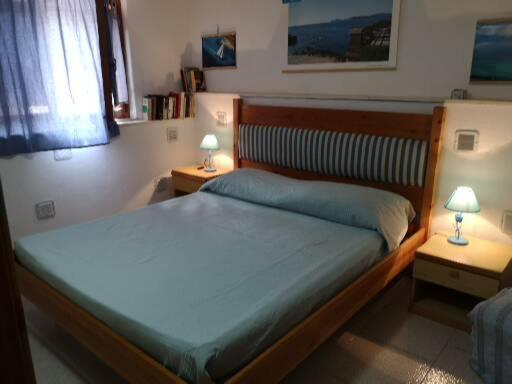 Ένα ή περισσότερα κρεβάτια σε δωμάτιο στο Casa Isa al mare