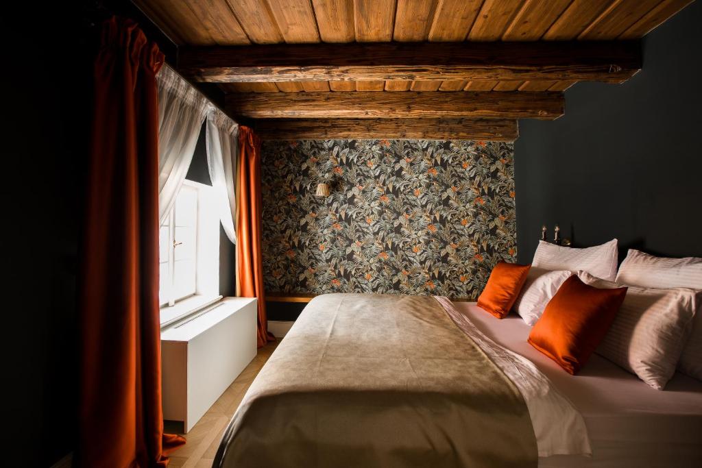 Postel nebo postele na pokoji v ubytování Hotel Nerudova 211