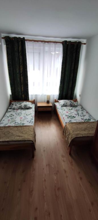 Postel nebo postele na pokoji v ubytování Pokoje gościnne u Sławka