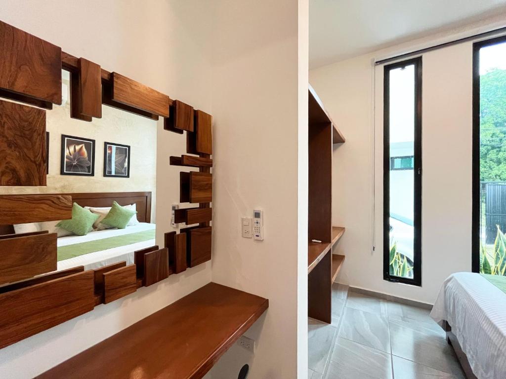Postel nebo postele na pokoji v ubytování HOTEL KOOKAY VALLADOLID