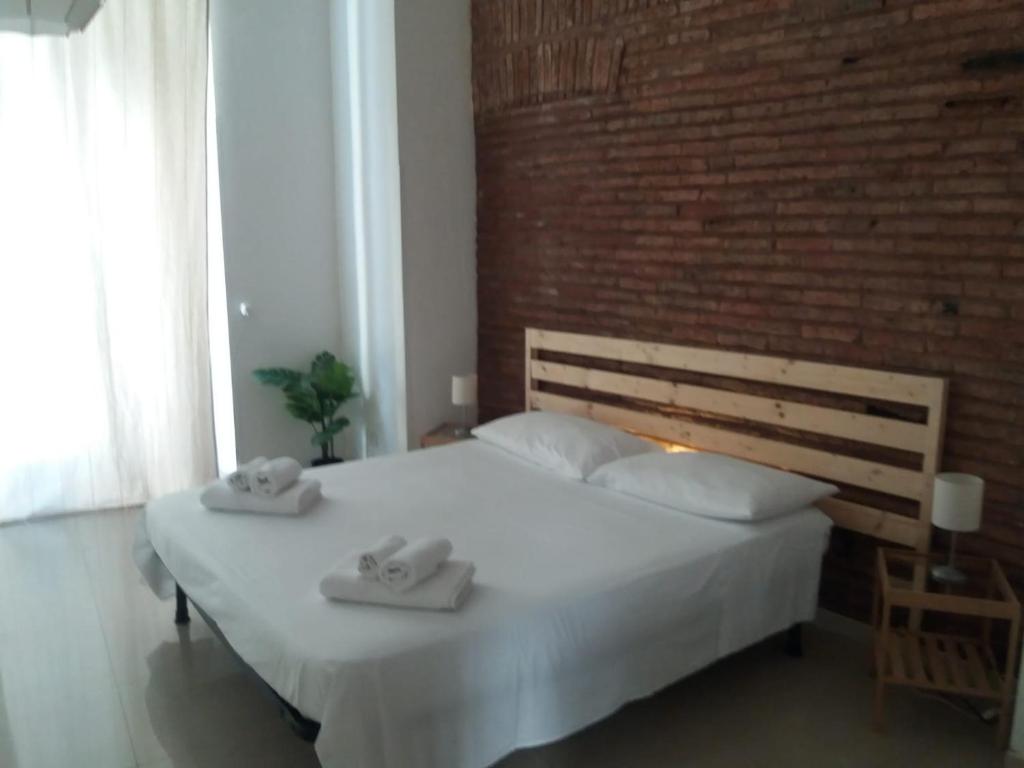 A bed or beds in a room at Tania's House