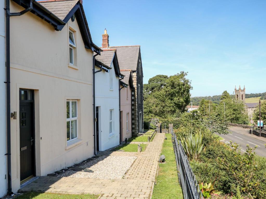 a row of houses on the side of a street at 4 The Cloisters in Bushmills