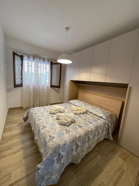 Кровать или кровати в номере Fondachello Sea House