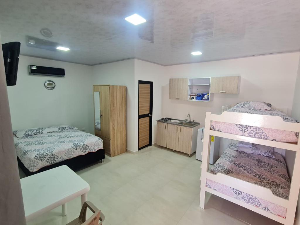 Ένα ή περισσότερα κρεβάτια σε δωμάτιο στο ALOJAMIENTO El Lago