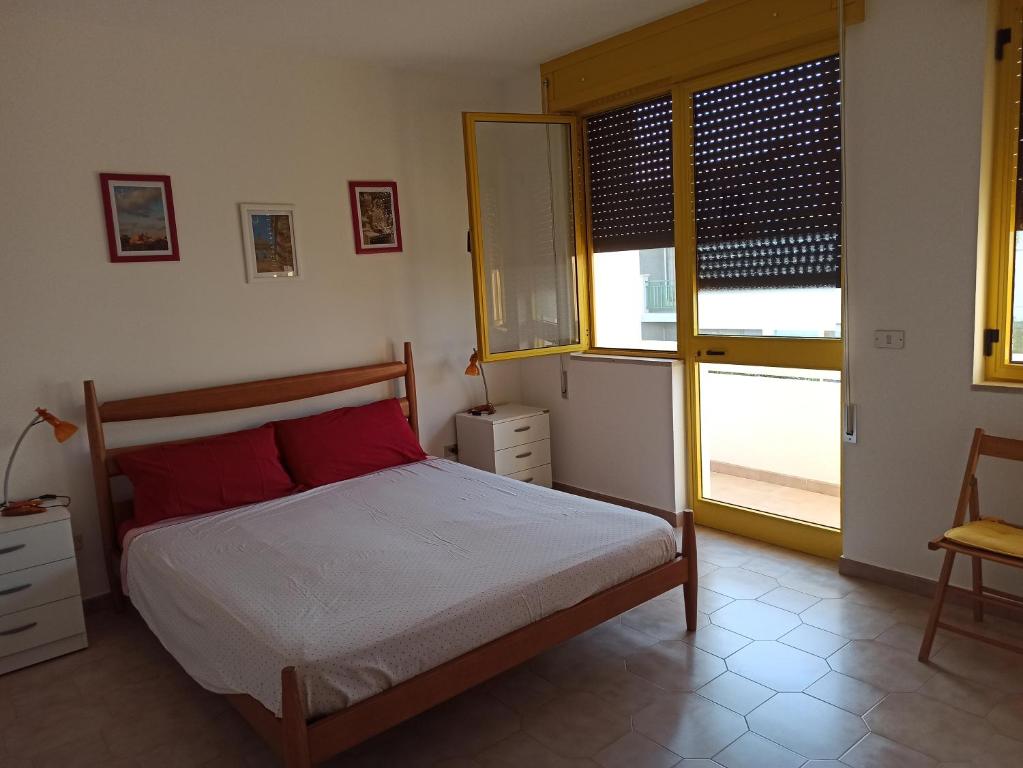 Postel nebo postele na pokoji v ubytování Casa Gialla