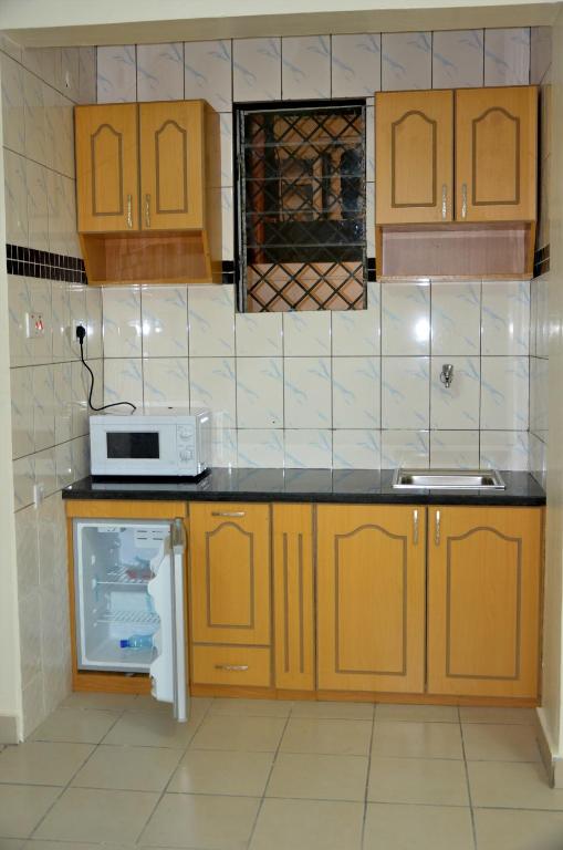 Kuchyň nebo kuchyňský kout v ubytování Coastgate Hotel