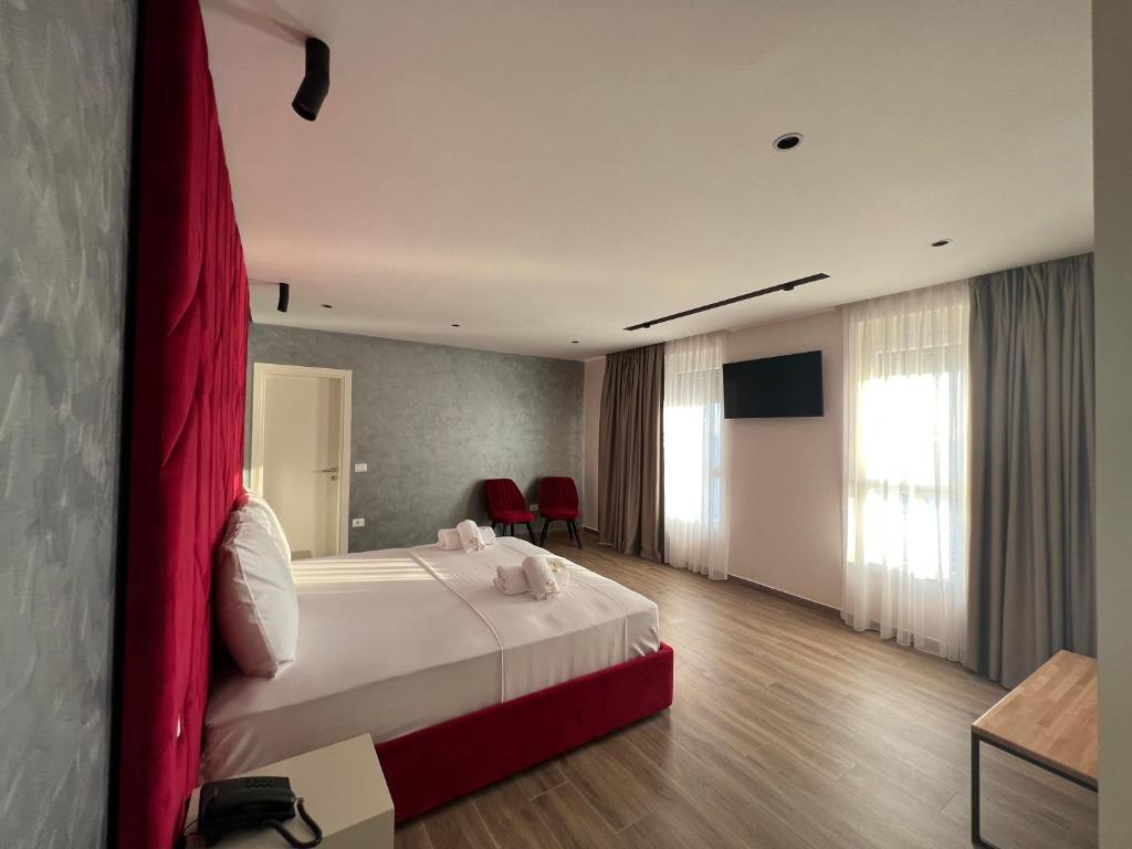 TV a/nebo společenská místnost v ubytování Hotel LEON - Beach Front