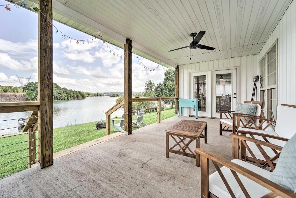 a screened porch with a view of the water at Cherokee Lake Home with Private Dock and Patio! in Bean Station