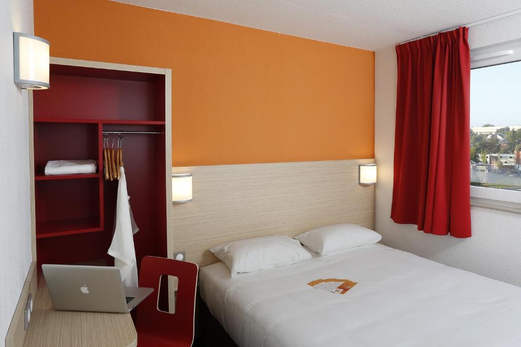 Ένα ή περισσότερα κρεβάτια σε δωμάτιο στο B&B HOTEL Gap