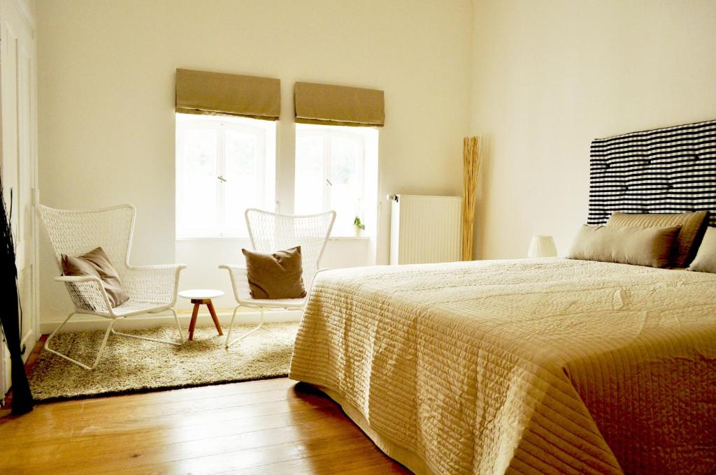 Postel nebo postele na pokoji v ubytování Art Hotel & Hostel