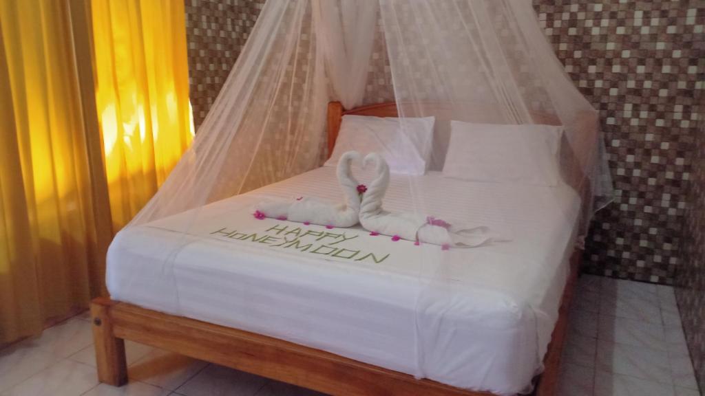 Llit o llits en una habitació de Pondok Pandi