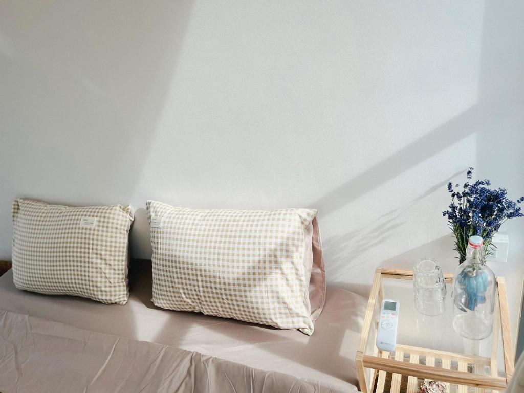 Giường trong phòng chung tại LIM Homestay