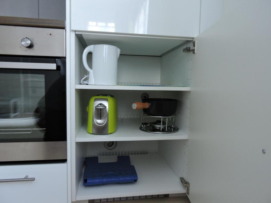 A cozinha ou kitchenette de Ferienwohnung Grütter