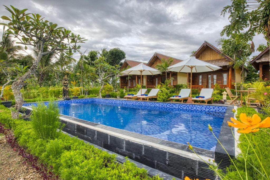 an image of a villa with a swimming pool at RR Cottage in Nusa Penida