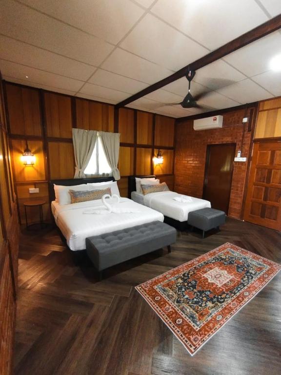 Postel nebo postele na pokoji v ubytování Api-api Eco Chalet