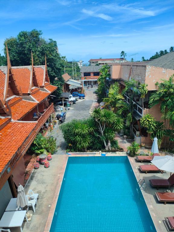 an overhead view of a swimming pool at a resort at Grand Thai House Resort Lamai in Lamai