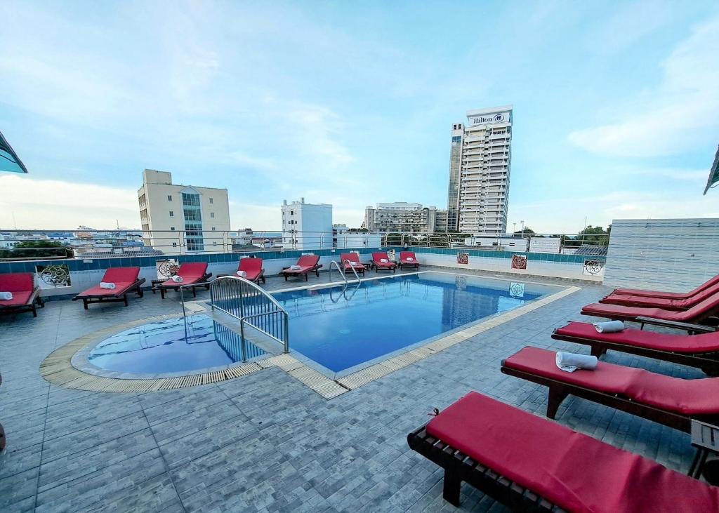 a swimming pool on the roof of a building at Thipurai City Hotel in Hua Hin