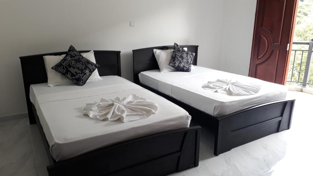 Ένα ή περισσότερα κρεβάτια σε δωμάτιο στο Sun Set Forest Villa