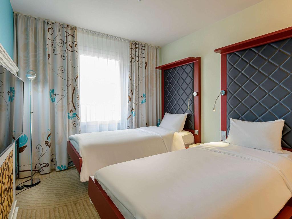 Postel nebo postele na pokoji v ubytování ibis Styles Hotel Berlin Mitte