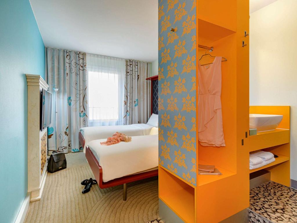 Postel nebo postele na pokoji v ubytování ibis Styles Hotel Berlin Mitte