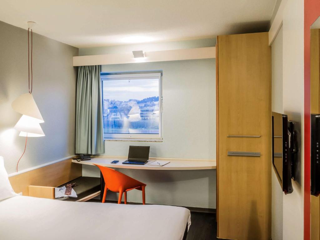 Postel nebo postele na pokoji v ubytování Hotel ibis Porto Sao Joao