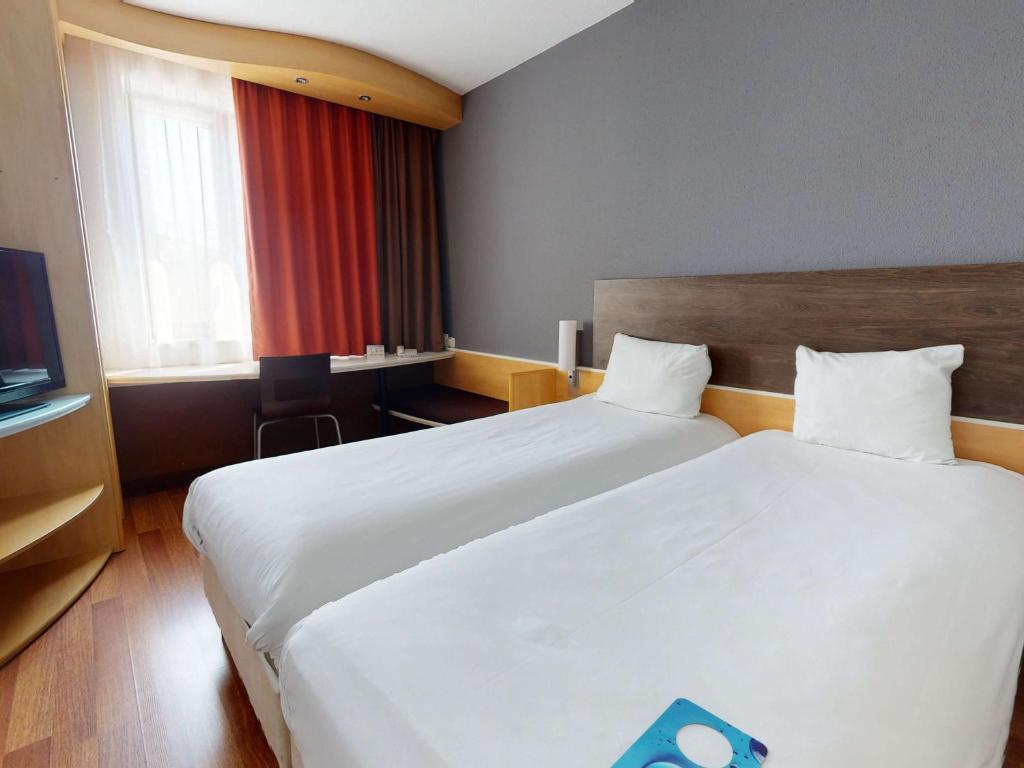 Postel nebo postele na pokoji v ubytování Ibis Bratislava Centrum