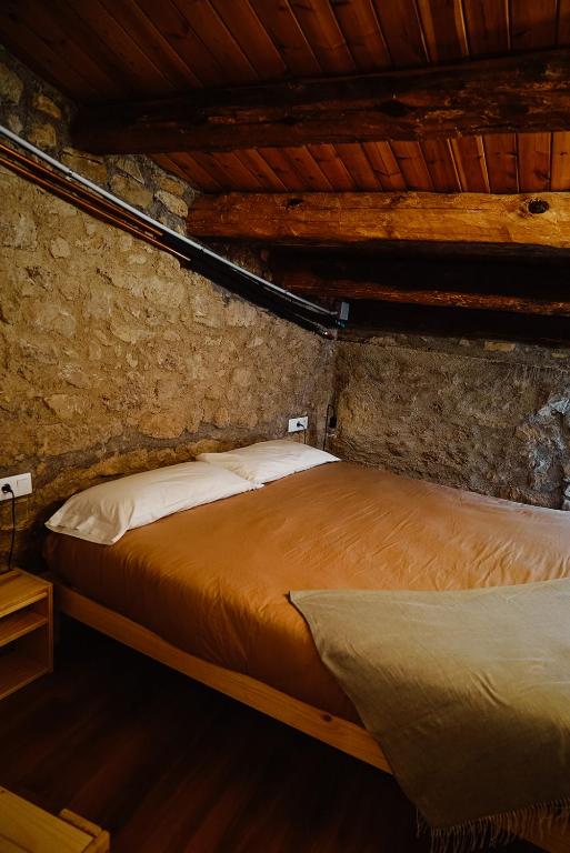 Postel nebo postele na pokoji v ubytování Cases Altes de Posada