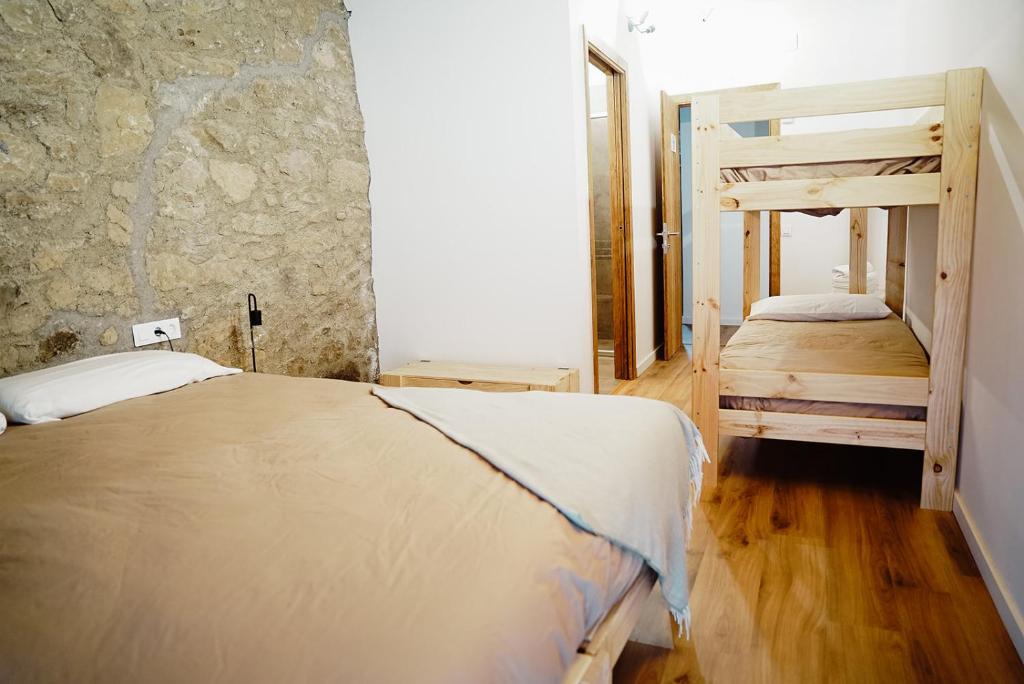 Postel nebo postele na pokoji v ubytování Cases Altes de Posada
