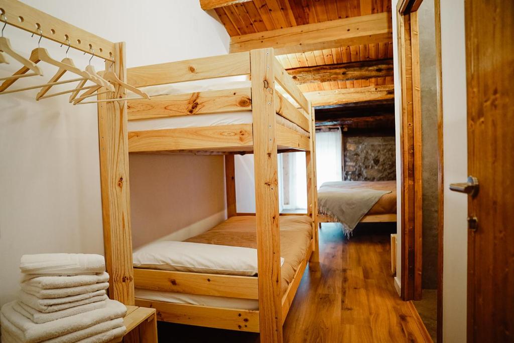 Postel nebo postele na pokoji v ubytování Cases Altes de Posada