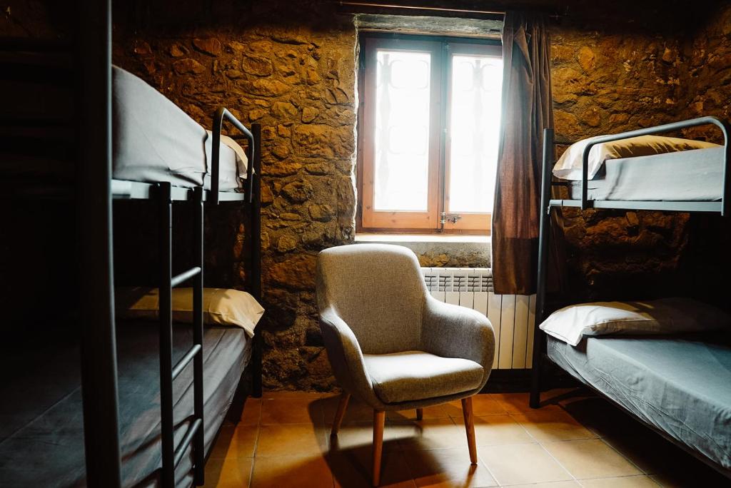 Postel nebo postele na pokoji v ubytování Cases Altes de Posada