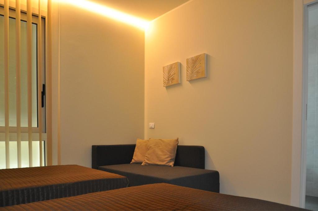 Posteľ alebo postele v izbe v ubytovaní Garda Bloom Holiday Apartments