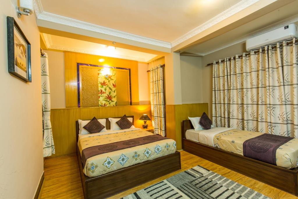 Postel nebo postele na pokoji v ubytování Hotel Acme Inn