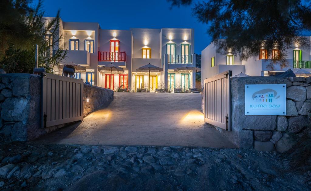 a building with a gate in front of it at night at KLIMA BAY Beachfront Boutique Houses in Klima