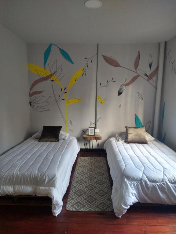 Postel nebo postele na pokoji v ubytování Casa la 15 Pereira