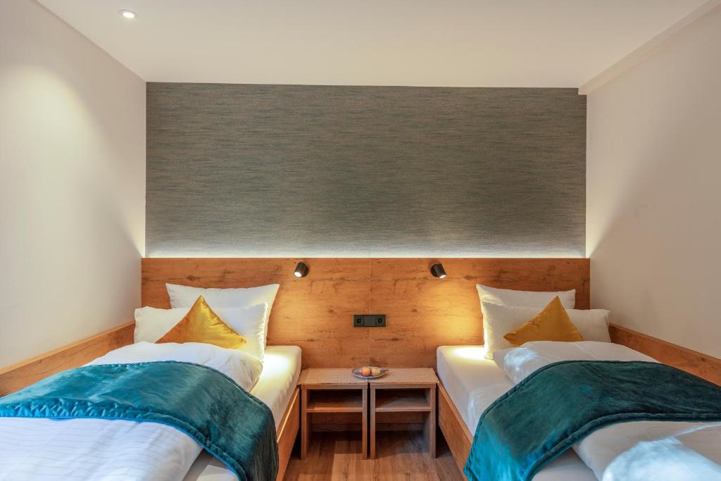 Postel nebo postele na pokoji v ubytování Hotel Langenwaldsee
