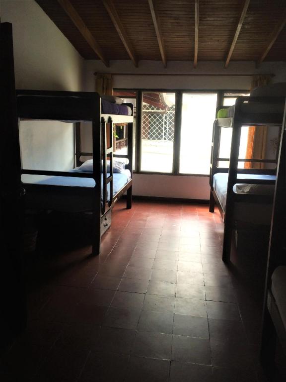 Postel nebo postele na pokoji v ubytování Casa Kiwi Hostel