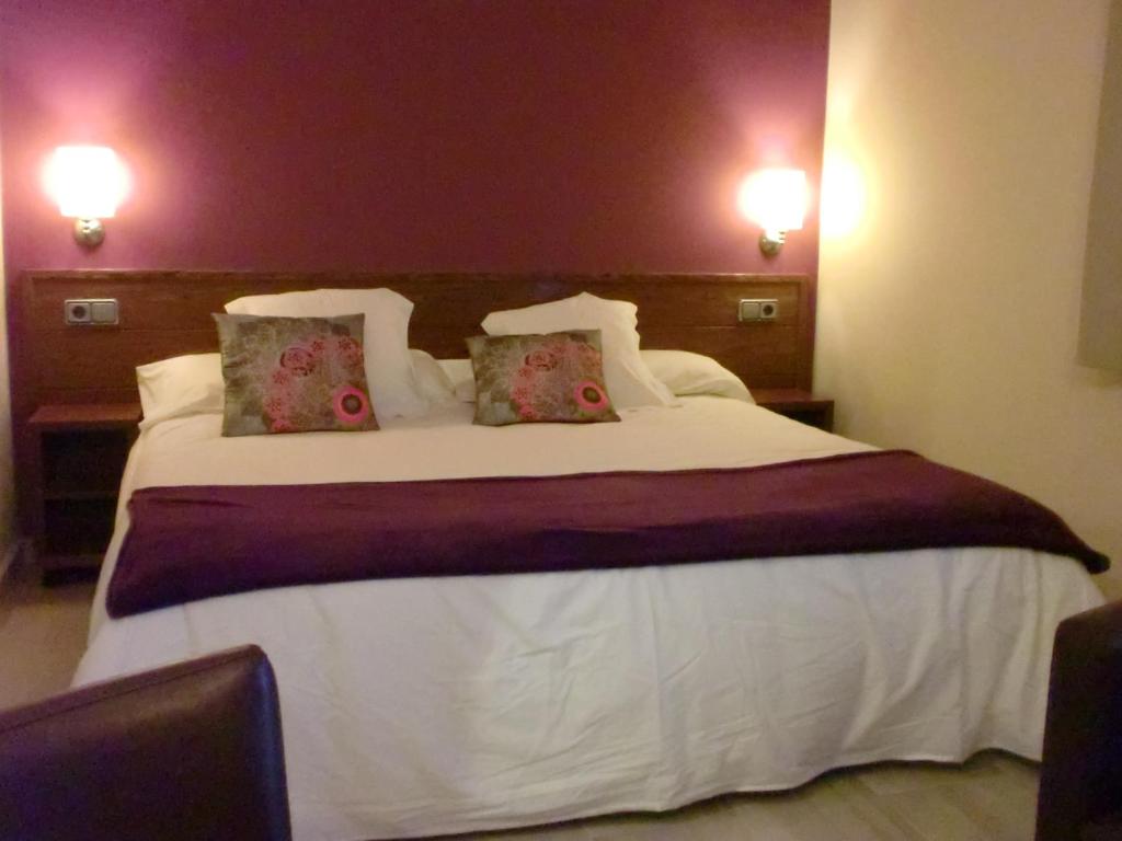 Postel nebo postele na pokoji v ubytování Hotel & Spa Can Josep