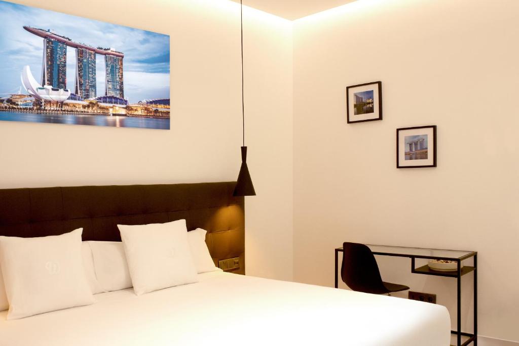 Postel nebo postele na pokoji v ubytování Woohoo Rooms Boutique Gran Vía